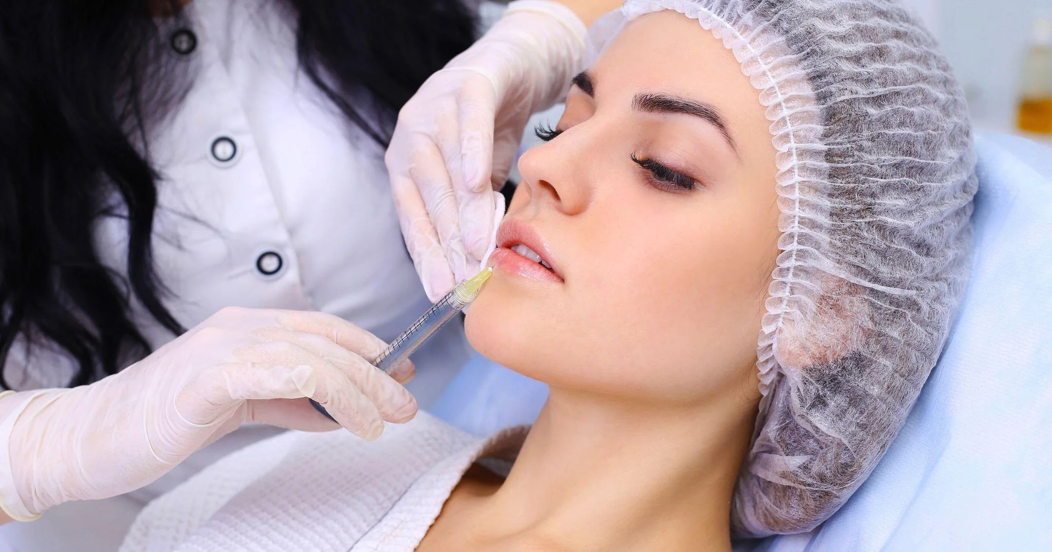 Clinician performing a lip filler treatment